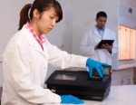 Lab technicians use the Hunter device during a test process. InstantLabs manufactures the Hunter system as well as test kits for food pathogens and species identification such as the catfish testing commercialization agreement outlined with the FDA.